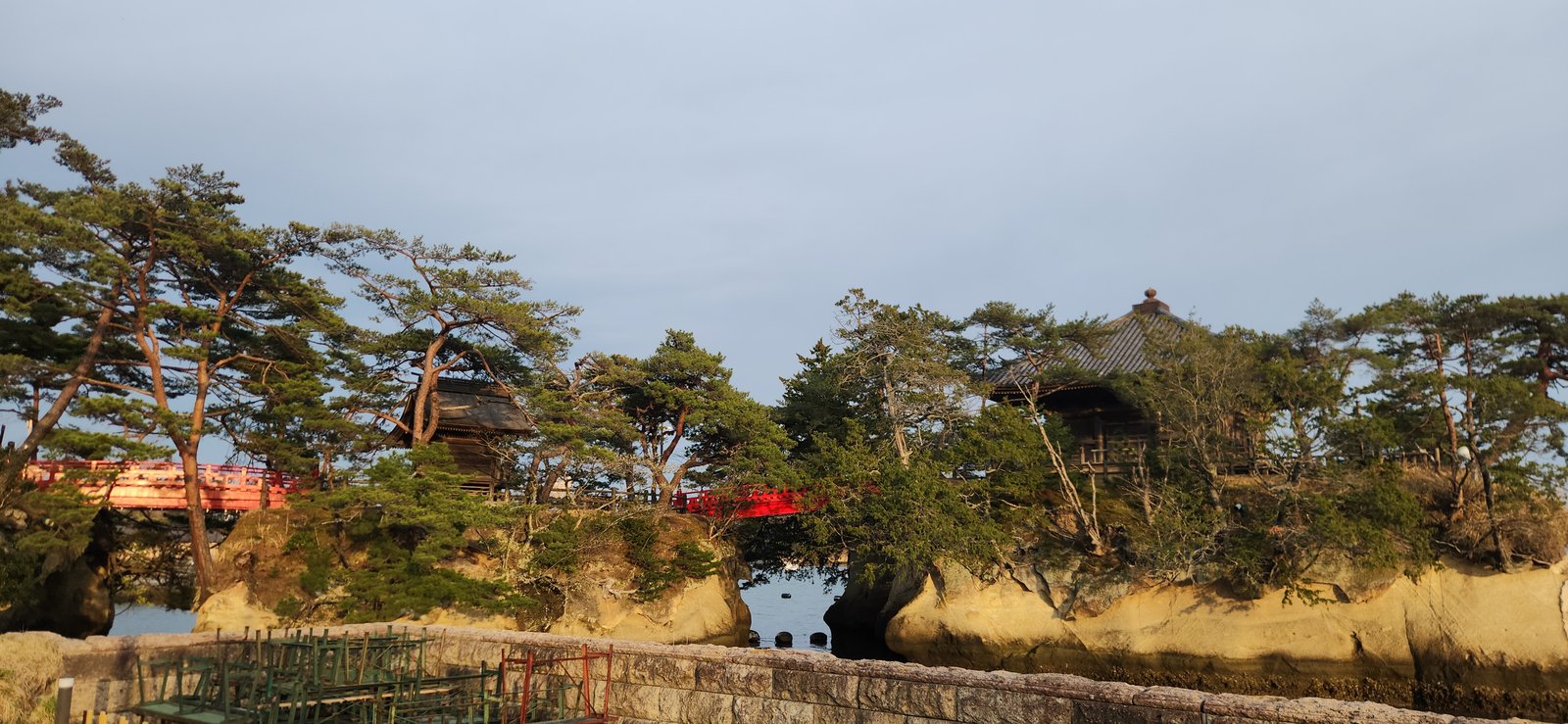 Matsushima Bay with pine-covered islands and sightseeing boats near the central waterfront.