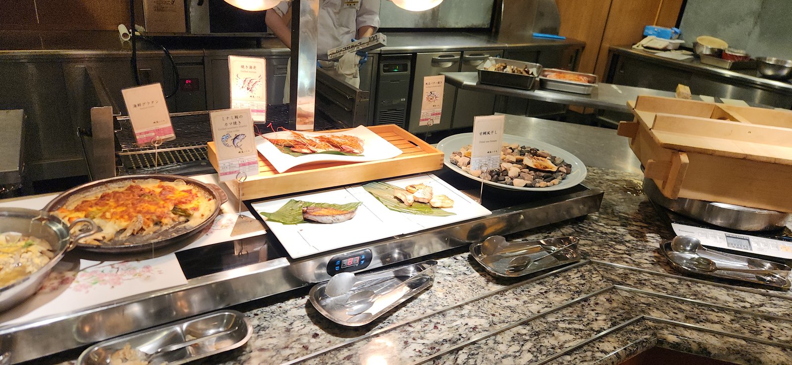 Sashimi and grilled seafood at a Japanese hotel dinner buffet