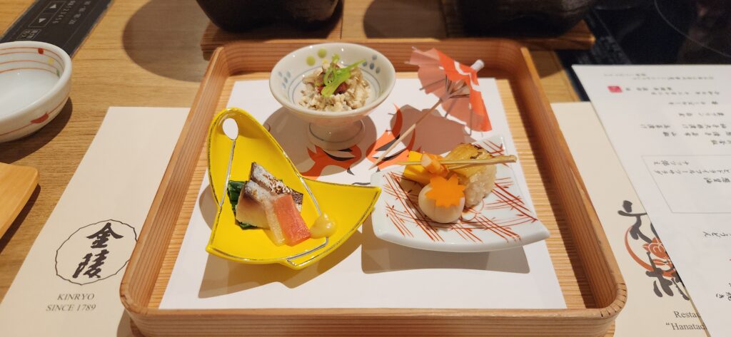 Multi-course kaiseki dinner spread at a Japanese ryokan.